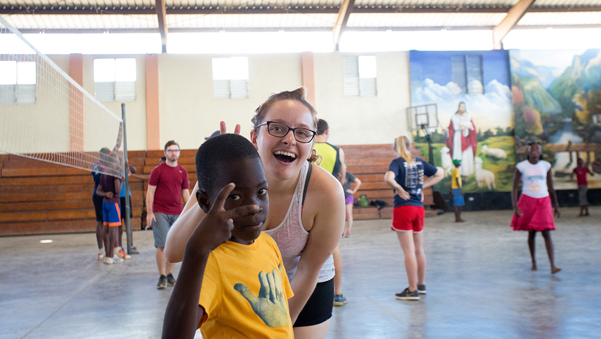 Amanda Bauman in gym with students